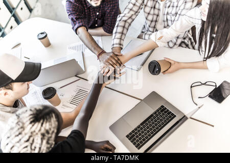 Diverse people group put hands together in stack pile at training as concept of sales team corporate unity connection, teambuilding loyalty, support i Stock Photo