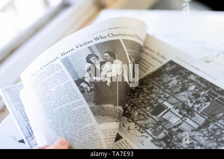 A stack of newspapers, The New York Times and USA Today, lay on a table. Stock Photo