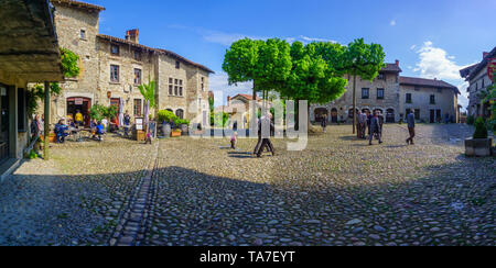Perouges, France - May 04, 2019: Scene of the main square, with locals and visitors, in the medieval village Perouges, Ain department, France Stock Photo