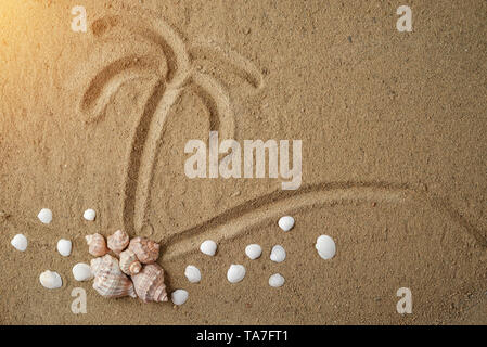 Creative minimal beach concept. Sand palm and seashell on sand background. Summer vacation concept.Flat lay, top view, copy space. Stock Photo