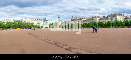 Lyon, France - May 09, 2019: Panoramic view of Place Bellecour square, with the equestrian statue of Louis XIV, locals and visitors, in Lyon, France Stock Photo