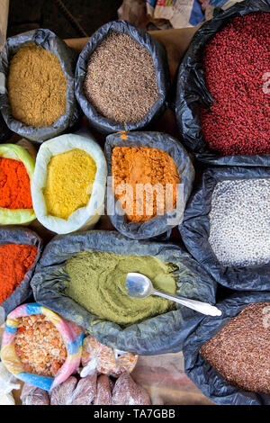 In the highlands north of Quit, Ecuador. Bags of colorful spices in Otavalo market town. Stock Photo