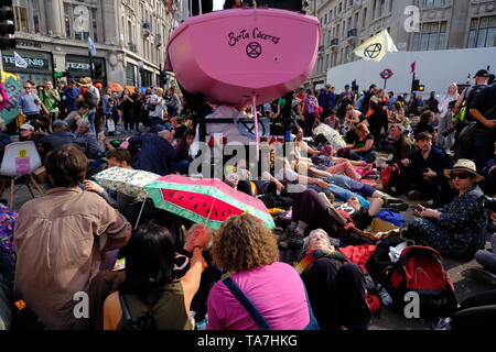 Extinction Rebellion protesters prepare for arrest on the fourth day of official protest at Oxford Circus. Stock Photo