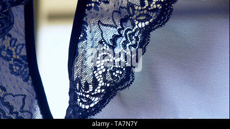 Blue lace on the dress. Close texture Stock Photo