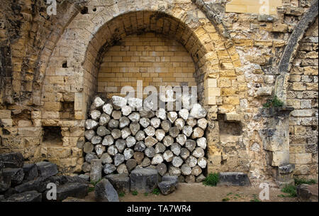 pile of rocks against a wall in a castle in valkenburg the netherlands Stock Photo