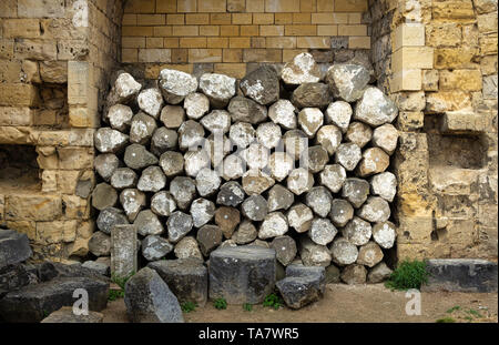 pile of rocks against a wall in a castle in valkenburg the netherlands Stock Photo