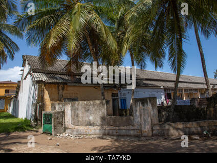 Old french colonial building tuned into houses for the local people in the UNESCO world heritage area, Sud-Comoé, Grand-Bassam, Ivory Coast Stock Photo