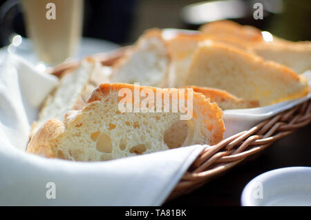 Toast bread in the basket on the table in caffe. Breakfast concept Stock Photo