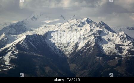 Snow disappearing in Austrian alps in the spring Stock Photo