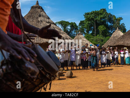Dan tribe women in line singing and dancing during a ceremony, Bafing, Gboni, Ivory Coast Stock Photo