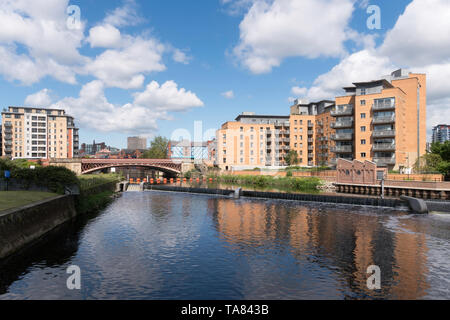 Crown Point Bridge over the river Aire and riverside apartment buildings in Leeds, Yorkshire, England, UK Stock Photo