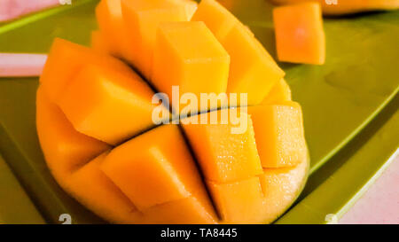 Mango fruit and mango cutting as cubes. Stock Photo