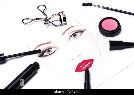 Face chart and different makeup objects and cosmetics on white background Stock Photo