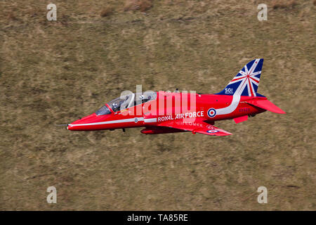 RAF Red Arrows Hawk T1 flying low level in the Mach Loop in Wales, UK Stock Photo