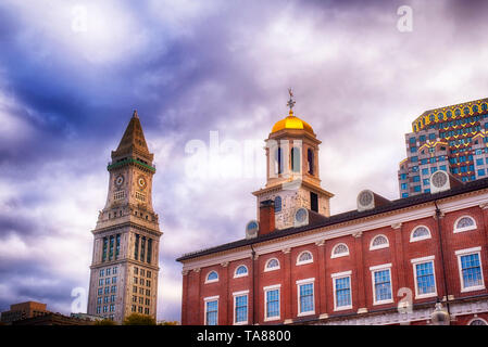 The custom house clock tower in the city of Boston Massachusetts cityscape on a cloudy blue sky day. Stock Photo