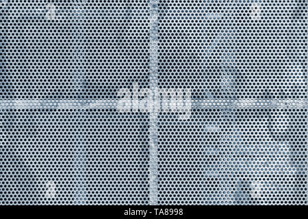 Close up of the gray colored metal background with the holes. Stock Photo