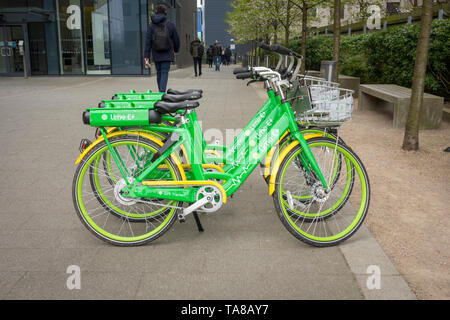 16th April 2019, North Acton, London. Lime e-assist bikes (Electric Assist bike hire scheme) parked in a row in North Acton, London, UK