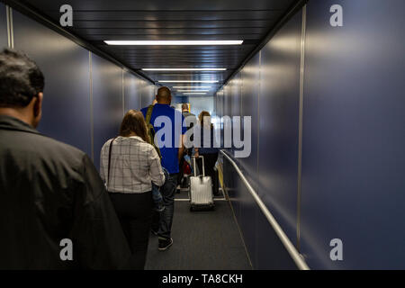 Walkway to airplane, Inside bridge that headed to plane Stock Photo