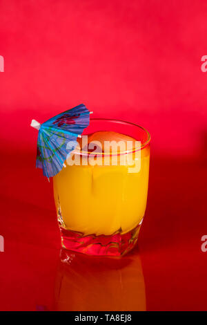 Vodka and Orange juice mixed drink with a cocktail umbrella. Stock Photo