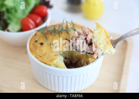 Homemade Shepherd pie , Mash potato with mince bacon and pork and salad Stock Photo