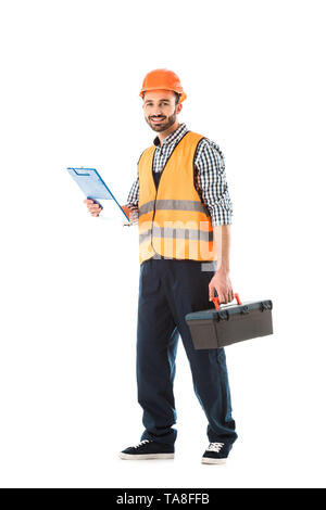 cheerful construction worker holding toolbox and clipboard isolated on white Stock Photo