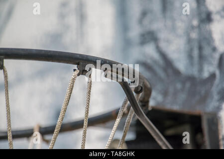 Closeup of basketball rim, net, and backboard - weathered street outdoor court Stock Photo