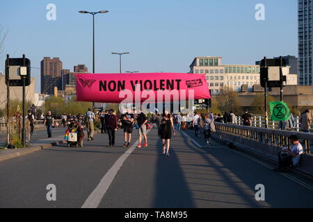 Extinction Rebellion 'Non Violent' banner stretched across activist occupied Waterloo Bridge during sixth day of protest Stock Photo