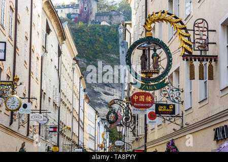 Salzburg, Austria - October 29, 2018: Famous shopping street Getreidegasse in historic Altstadt or Old Town of Salzburg Stock Photo