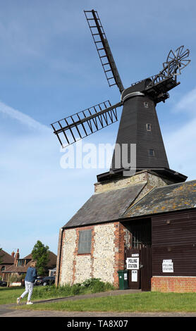 A lady arrives to cast her votes at a polling station at West Blatchington Windmill near Hove, as voters head to the polls for the European Parliament election. Stock Photo