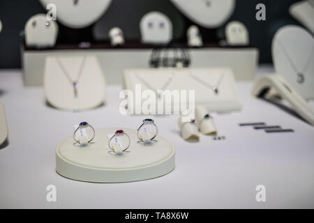 Geneva, Switzerland, March 03, 2019, Gold wedding engagement rings with diamond, brilliant cut on display for sale, gold silver platinum fiancee rings Stock Photo