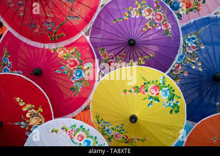 colorful handmade paper umbrella with flower painting. popular and famous Thai handicraft and souvenir. Stock Photo