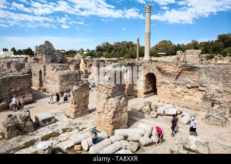 CARTHAGE, TUNISIA, AFRICA-CIRCA MAY, 2012: Visitors walk in thermal baths of the emperor Antoninus. Archaeological site. It was the center or capital  Stock Photo