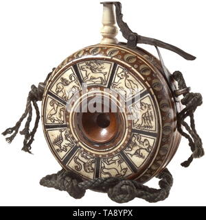 A German bone-inlaid powder flask, circa 1620 Round wooden flask with radial and circular bone inlays on one side, reverse side 9-fold segmented and inlaid and engraved with various animals in bone. Two lateral strap lugs. Spout and spring-mounted closure replaced. Diameter 10 cm. historic, historical, powder flask, accessory, accessories, military, militaria, object, objects, stills, utilities, utility, clipping, clippings, cut out, cut-out, cut-outs, utensil, piece of equipment, utensils, 17th century, Additional-Rights-Clearance-Info-Not-Available Stock Photo