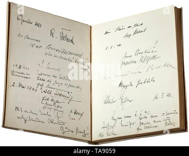 A guest book belonging to the Reich stage designer Benno von Arent (1898 - 1956) - with original signatures, including Adolf Hitler, Joseph Goebbels The book with a parchment binding (wavy) and gilt edged pages. Eminent politicians, military figures and civilians with approximately 150 original signatures and dedications spread over 27 pages, dating from the period 1938-43. Including Adolf Hitler, Joseph and Magda Goebbels, Arno Breker, Hermann Fegelein, Josef (Sepp) Dietrich, Albert Speer and others according to the enclosed list. Album dimensions circa 20 x 24.5 x 2.5 cm., Editorial-Use-Only Stock Photo