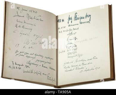 A guest book belonging to the Reich stage designer Benno von Arent (1898 - 1956) - with original signatures, including Adolf Hitler, Joseph Goebbels The book with a parchment binding (wavy) and gilt edged pages. Eminent politicians, military figures and civilians with approximately 150 original signatures and dedications spread over 27 pages, dating from the period 1938-43. Including Adolf Hitler, Joseph and Magda Goebbels, Arno Breker, Hermann Fegelein, Josef (Sepp) Dietrich, Albert Speer and others according to the enclosed list. Album dimensions circa 20 x 24.5 x 2.5 cm., Editorial-Use-Only Stock Photo