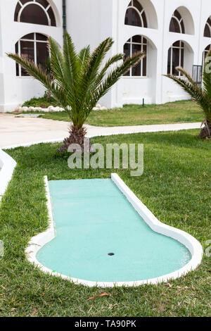 Section of mini golf game is on hotel area, pleasure for visitors and guests, an empty field Stock Photo