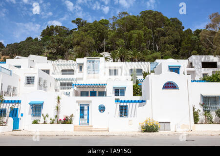 SIDI BOU SAID, TUNISIA, AFRICA-CIRCA MAY, 2012: Blue and white buildings are in low village of Sidi Bou Said. Foothill district with surroundings. It  Stock Photo