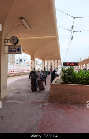 MONASTIR, TUNISIA-CIRCA MAY, 2012: Passengers come to platform in Monastir key middle station. The Sahel Metro is an electrified, metre gauge railway  Stock Photo