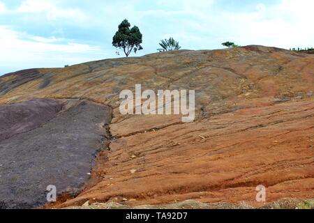 Unusual volcanic formation seven colored piles of earth in Chamarel.The main sight of Mauritius island. Stock Photo