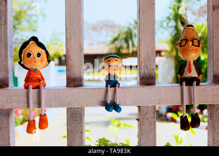 Toy miniatures on window. Stock Photo