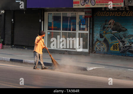 PUNE, MAHARASHTRA, INDIA, February 2019, Man clean street in the morning. Stock Photo