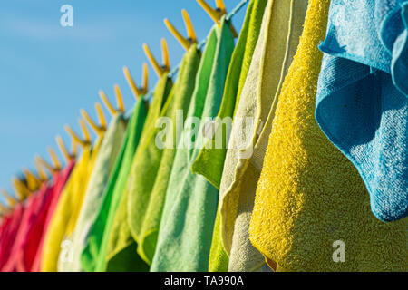 Microfibre cleaning cloths on a washing line. Stock Photo