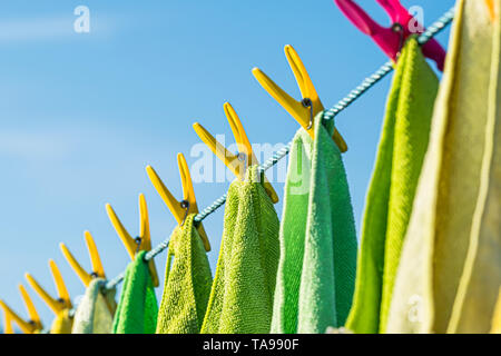Microfibre cleaning cloths on a washing line. Stock Photo