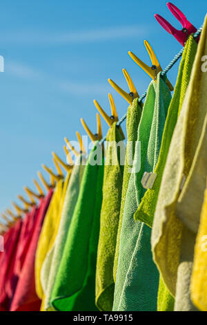 Microfibre cleaning cloths on a washing line. Stock Photo