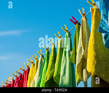 Microfibre cleaning cloths on a washing line. Stock Photo