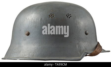 A helmet M 34 for members of the German Red Cross Grau lackierte Stahlblechglocke, nahezu vollständig erhaltenes DRK-Emblem, komplettes Innenfutter mit Kinnriemn. historic, historical, State, state-controled, state-run, organisations, organizations, organization, organisation, object, objects, stills, clipping, clippings, cut out, cut-out, cut-outs, utensil, piece of equipment, utensils, 20th century, Additional-Rights-Clearance-Info-Not-Available Stock Photo
