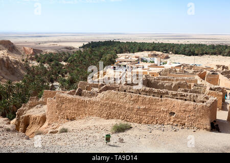 TOZEUR, TUNIS-CIRCA MAY, 2012: Ruins of old town Chebika, abandoned in 1969 after catastrophic flooding. Now it is mountain oasis at foot of the Djebe Stock Photo