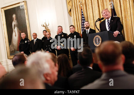 Washington, USA. 22nd May, 2019. U.S. President Donald Trump (1st R, back) speaks during the Public Safety Officer Medal of Valor presenting ceremony at the White House in Washington, DC, the United States, on May 22, 2019. Credit: Ting Shen/Xinhua/Alamy Live News Stock Photo