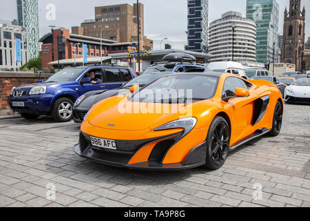 Liverpool, Merseyside. 23rd May, 2019 UK Weather: Fine, sunny sailing condition as up to 200 motorcyclists and tens of supercars including a Mclaren 675LT Coupe S-A, queue to board the ferry to the Isle of Man to attend the island TT races.  Extra ferry services are to be added to cope with the large demand for spectators travelling to attend this year’s top motor sport week of qualifying events of the fastest road race on the planet. Credit: MediaWorldImages/AlamyLiveNews Stock Photo