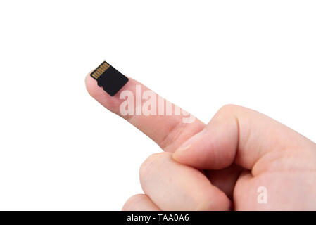 Hand with Micro SD card isolated on white background Stock Photo